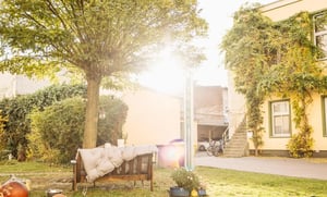 Bench with cushion and garden outdoor area at Welcoming 1 double bedroom apartment not too far from Lipsia in Magdeburg Student Accommodation