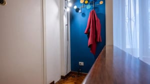 Coat rack with coat near window entrance area at Modern 1 bedroom apartment in Ardenza in Livorno Student Accommodation