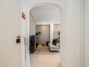 Sofa television and plants living room at Inviting 1-bedroom apartment in Quarteira in Quarteira Student Accommodation