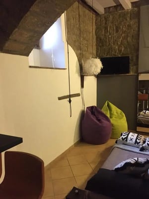 Beanbags bed and furniture communal area at Cosy studio in the historical centre in Viterbo Student Accommodation
