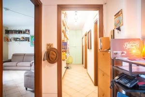 Hallway with hat on wall and shelves living room at Ideal room for workers - students in Bergamo city equipped for work, with its own fridge in Bergamo Student Accommodation