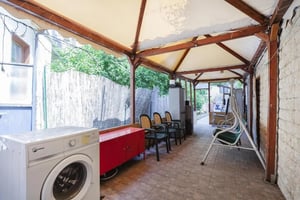 Washing machine red cabinet chairs swing exterior at Cool room near Basilica San Paolo metro station in Rome Student Accommodation
