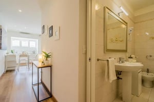 Kitchenette and bathroom with sink and mirror at Spacious Studio in Mestre in Venice Student Accommodation