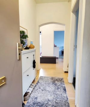Hallway with shoe cabinet rug and archway hallway at Nice single bedroom in a 4-bedroom flat, in proximity to the German University in Cairo - Berlin Campus in Berlin Student Accommodation