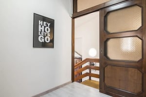 Artwork and sliding door hallway interior at Single bedroom in a house close to Mestre train station in Venice Student Accommodation
