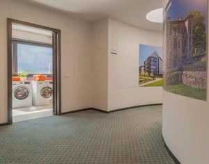 Two washing machines and laundry room exterior at Luminous ensuite single bedroom in North Trento in Trento Student Accommodation