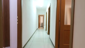 Hallway with multiple doors and tiled floor Hallway at Inviting single ensuite bedroom near Università degli Studi di Sassari in Sassari Student Accommodation