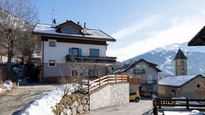 Houses with snow and mountains exterior at Cosy 1-bedroom apartment in Molina in Valdidentro Student Accommodation