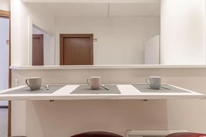 Mugs and spoons on a counter kitchen at Inviting single ensuite bedroom in Sassari in Sassari Student Accommodation