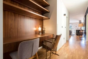 Wooden desk two chairs lamps study area at Large and modern 3-bedroom flat near the Régua train station in Vila Real Student Accommodation