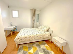 Bed desk rug bedside table bedroom at Comfy double bedroom near the Gare de Rosny Bois Perrier in Paris Student Accommodation