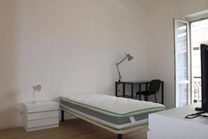 Bed desk chair and nightstand bedroom at Pleasant single bedroom in Santa Lucia in Bergamo Student Accommodation