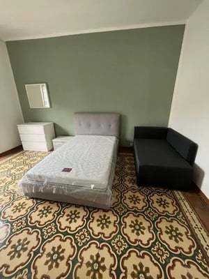 Bed dresser sofa mirror bedroom at Welcomig Double Bedroom close to Palazzo Reale di Torino in Turin Student Accommodation