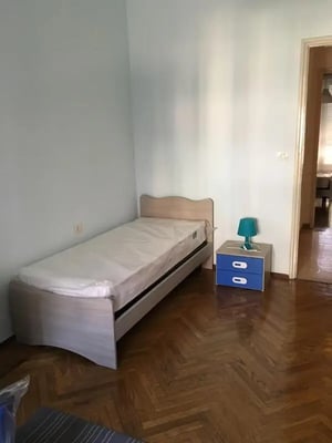 Single bed with blue bedside table Bedroom at Single bedroom in a shared 5 bedroom apartment_ROOM1 in Turin Student Accommodation