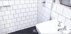 White tiled shower sink and chrome fixtures bathroom at Welcoming studio in Brunnenviertel in Berlin Student Accommodation