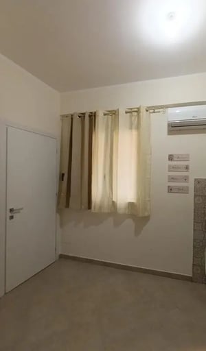 Door curtains air conditioner wall art interior at Comfortable studio close to Università di Palermo in Palermo Student Accommodation