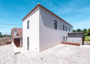 Modern white building with tile roof exterior at Luxury 6 Bedroom House with a swimming pool close to Afife Beach in Viana Do Castelo Student Accommodation