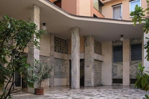 Marble columns glass block windows potted plants exterior at Delightful single bedroom in Crocifissa di Rosa in Brescia Student Accommodation