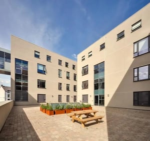 Picnic table planter boxes building courtyard exterior at Copley Court in Cork Student Accommodation