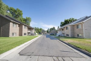 Apartment buildings with stairs and grassy lawns exterior at Afton Apartments in Logan Student Accommodation