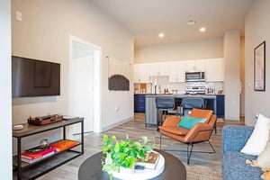 Sofa tv turntable and kitchen area living room at Ascend Richmond Student Living in Richmond Student Accommodation