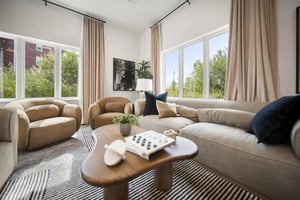 Modern living room with neutral sofa and chairs at Block20