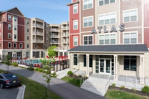 Apartment complex pool and entrance exterior at Atlas on 17th in Bloomington Student Accommodation