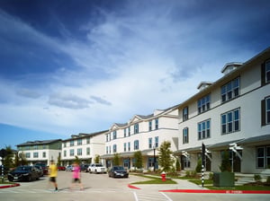 Townhouses with cars parked outside exterior at The Junction at College Station in College Station Student Accommodation