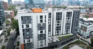 Modern apartment building with rooftop patio exterior at Post Chicago Apartments in Chicago Student Accommodation