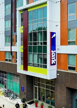 Modern building with colorful accents and bikes exterior at Lark at Randall in Madison Student Accommodation