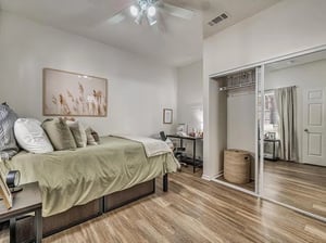 Bed desk closet and artwork bedroom interior at Aggie Station in Bryan Student Accommodation
