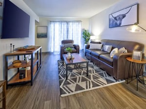 Brown leather sofa and chair living room living room at Willowtree Apartments & Tower in Ann Arbor Student Accommodation