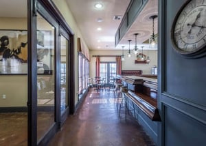 Bar stools counter chairs and paintings common area at The Verge Apartments Las Cruces in Las Cruces Student Accommodation