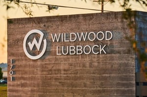 Wildwood Lubbock sign on concrete exterior exterior at Wildwood Lubbock in Lubbock Student Accommodation