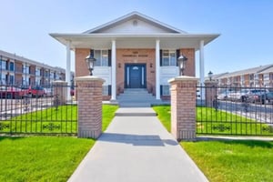 Brick pillars flanking entrance to property exterior at The Colonial House in Rexburg Student Accommodation