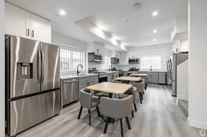 Stainless steel fridge tables chairs kitchen at 1476 W 35th St in Los Angeles Student Accommodation