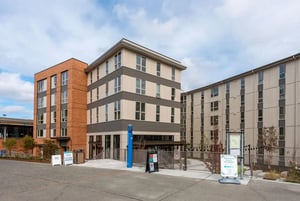 Modern buildings with many windows exterior at 7000 Campus Living Apartments in Shoreline Student Accommodation