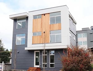Modern townhouse with wood and gray siding exterior at Husky Urban Living in Seattle Student Accommodation