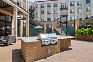 Grill and seating area on patio exterior at The Eden Apartments in Cincinnati Student Accommodation