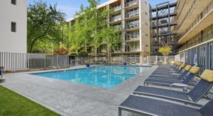 Pool lounge chairs building exterior and pool Playing area at 1016 Lofts in Atlanta Student Accommodation