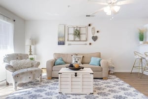 Sofa armchair coffee table rug living room at Belmont Landing in Farmville Student Accommodation