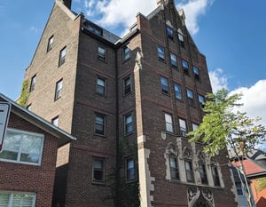 Brick building with windows and trees exterior at 5748 Blackstone by 3L Living in Chicago Student Accommodation