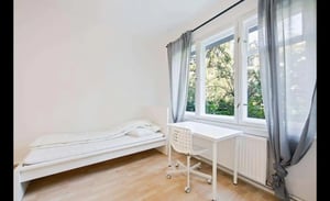 Bed with pillows and wardrobes bedroom at Room in Treseburger Ufer 44A, 12347 Berlin, Germany in Berlin Student Accommodation