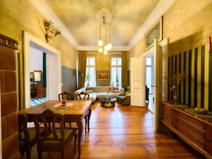 Dining table chairs sofa cabinet living room at Apartment in Köpenicker Str. 6, 10997 Berlin, Deutschland in Berlin Student Accommodation