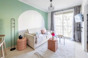 Sofa with cushions and decorative tables living room at Apartment in Av. de Verdun, 75010 Paris, France in Paris Student Accommodation