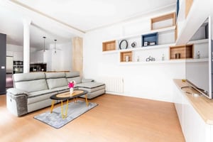 Sofa coffee table rug kitchen area living room at Apartment in 45 Rue de Ponthieu, 75008 Paris, France in Paris Student Accommodation