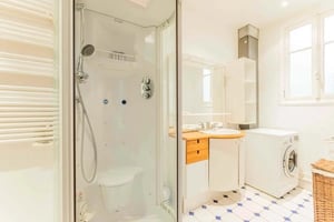 Shower cabinet sink washing machine bathroom at Apartment in 4 Rue Henri Duchêne, 75015 Paris, France in Paris Student Accommodation