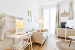Desk sofa and bunk bed living area at Studio in 10 Rue Jean-Jacques Rousseau, 75001 Paris, France in Paris Student Accommodation
