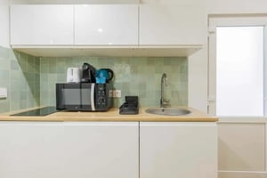Microwave kettle coffee machine sink dish rack kitchen at Studio in 218 BIS Rue Saint-Denis, 75002 Paris, France in Paris Student Accommodation
