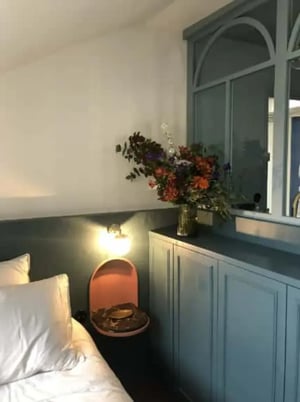Bedside shelf with flowers and cabinets Bedroom at Studio in 23 Rue du Cherche-Midi, 75006 Paris, France in Paris Student Accommodation